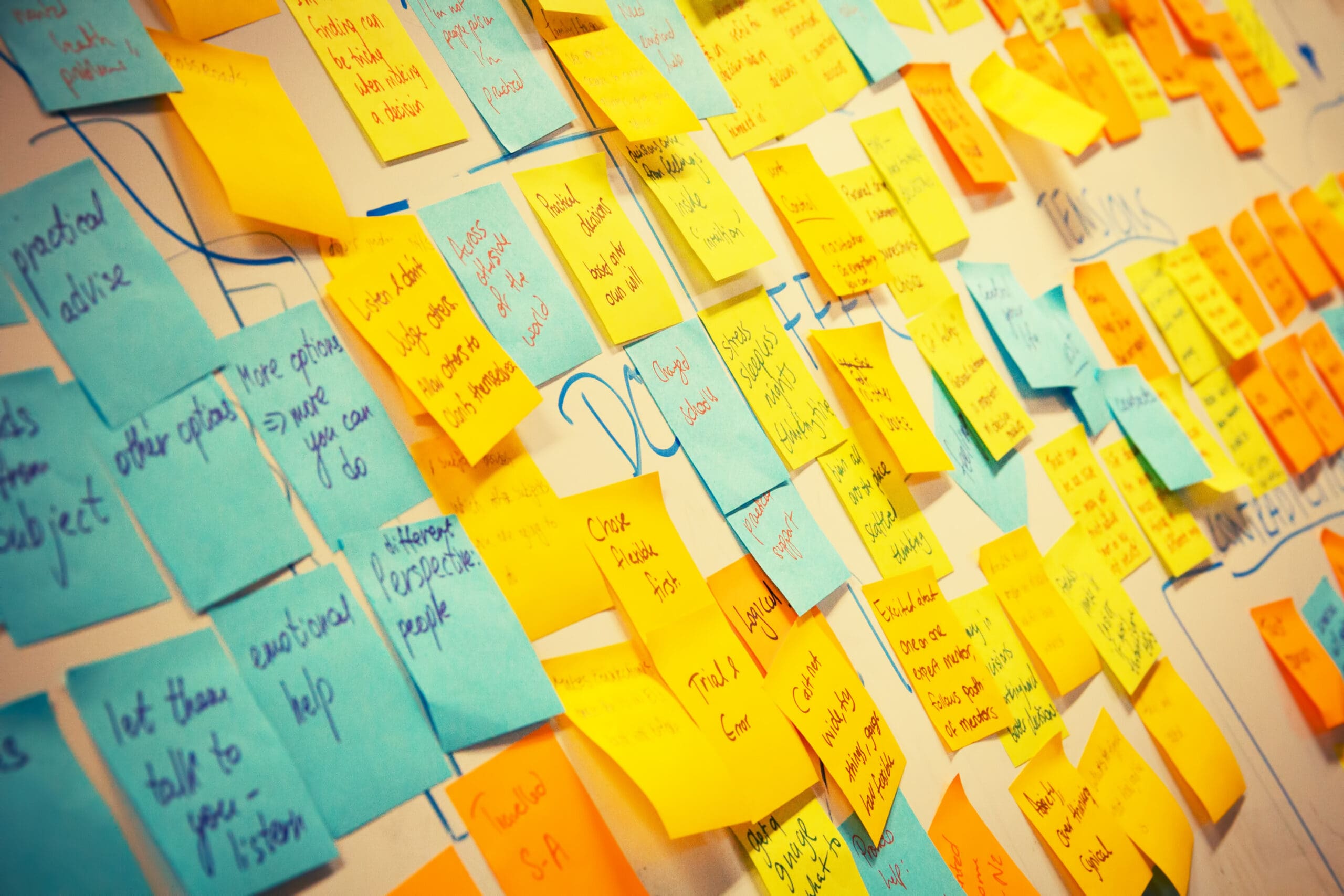 blue and white post-it notes on a wall