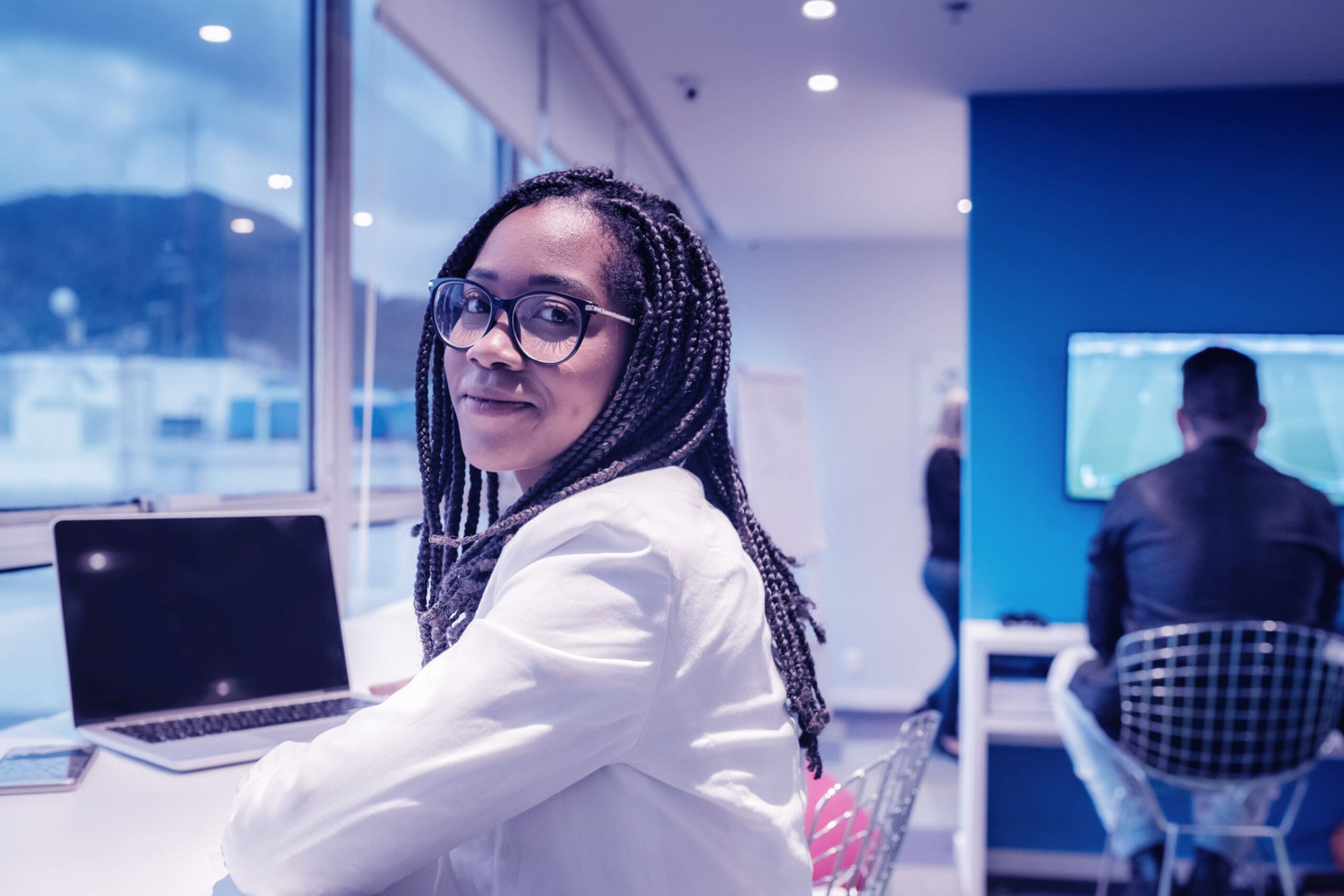 woman with a laptop in modern office